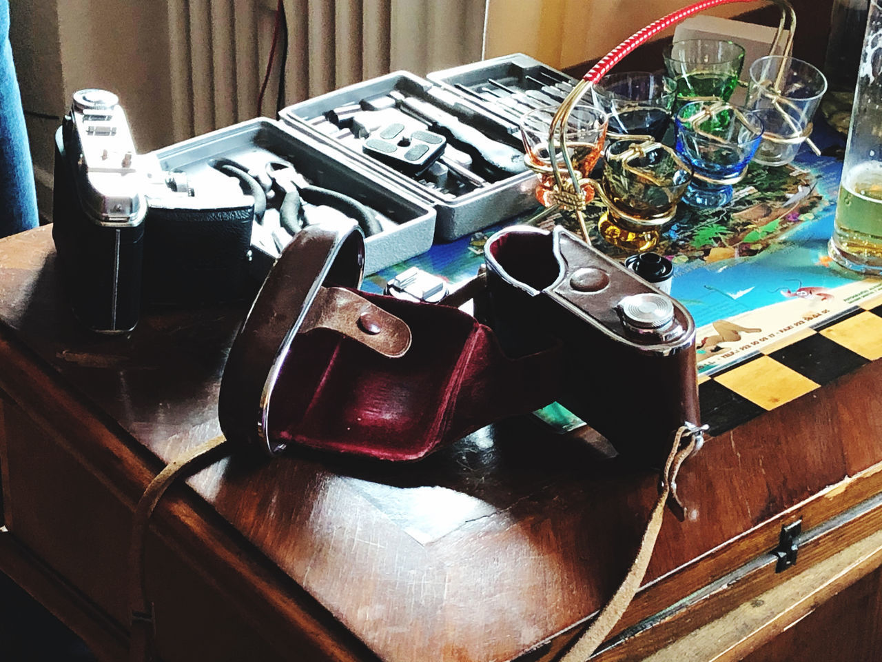 HIGH ANGLE VIEW OF CAMERA ON TABLE AT HOME