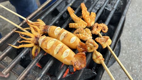 Close-up of sausages on barbecue grill