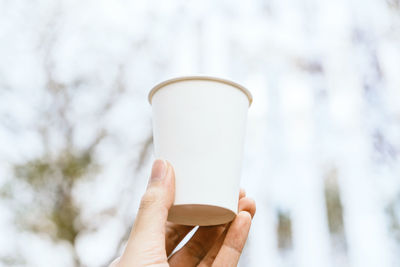 Close-up of hand holding ice cream