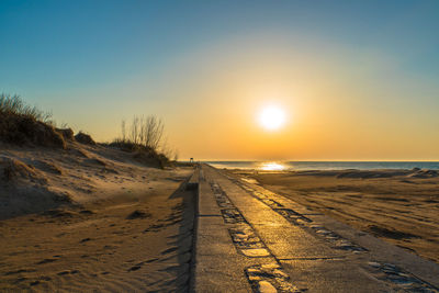 Scenic view of sea against clear sky during sunset