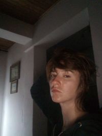 Portrait of a young woman looking away at home