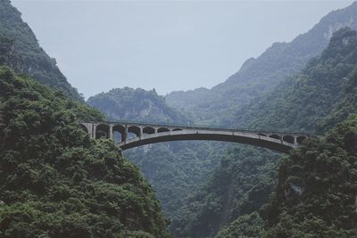 High angle view of bridge over river against mountains