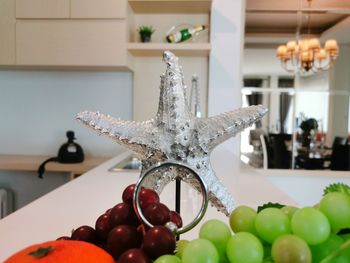 Close-up of fruits on table at home