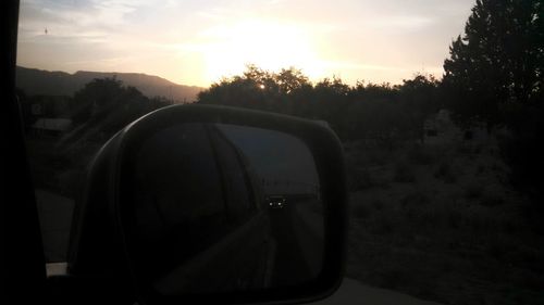 Car on road at sunset