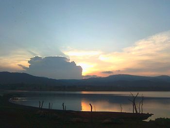 Scenic view of lake at sunset