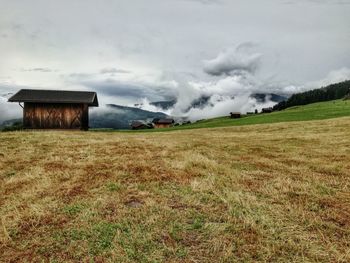 House on field against sky