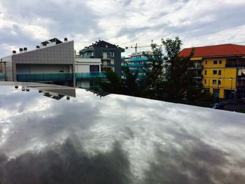 Houses against cloudy sky