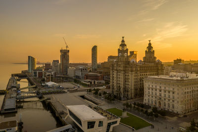 High angle view of buildings against sky during sunset