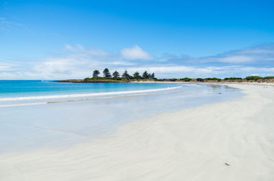 View of beach against cloudy sky