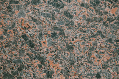 Red granite texture close up