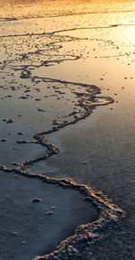 High angle view of beach against sky during sunset