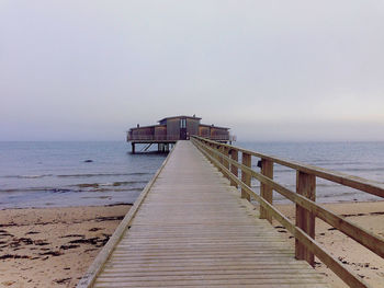 Empty jetty leading to sea