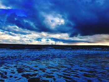 Scenic view of sea against blue sky