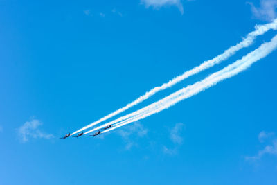 Low angle view of airplane flying in sky