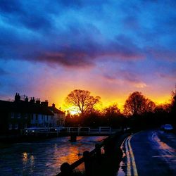 Scenic view of river against sky during sunset