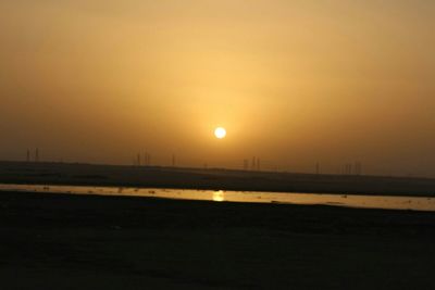 Scenic view of landscape at sunset