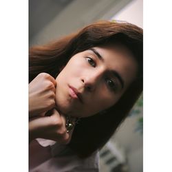 Close-up portrait of smiling young woman