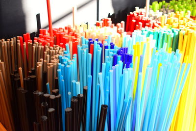 High angle view of colorful drinking straws for sale in store