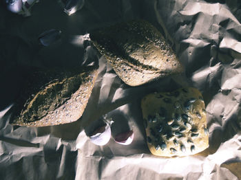 High angle view of bread and garlic on table