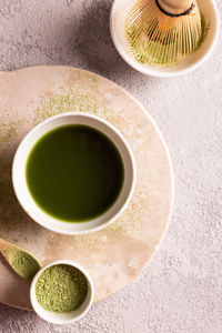 Powdered green tea matcha on a white stone board