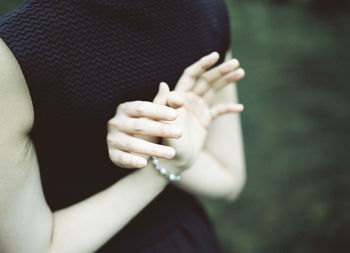 Close-up of young woman with her arms crossed