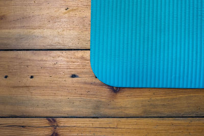 Directly above shot of blue place mat on wooden table