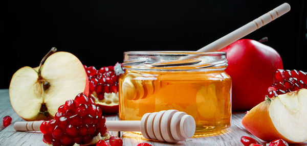 Close-up of drink on table against black background