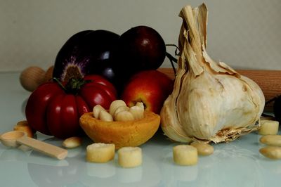 Close-up of tomatoes and vegetables on table