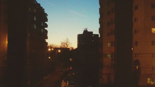 Buildings in city at sunset