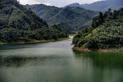 Scenic view of river and mountains