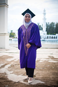 Portrait of smiling girl standing outdoors