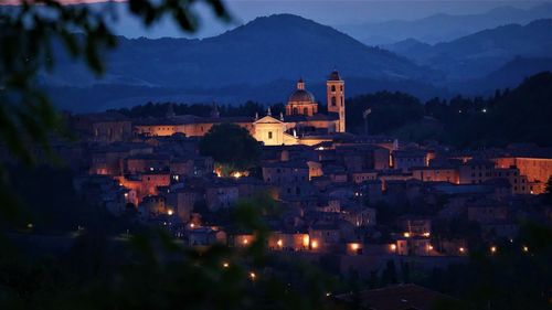 High angle view of illuminated buildings in city at night