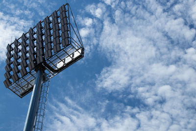 Low angle view of flood light against sky