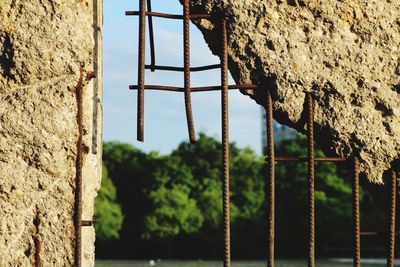 Close-up of rusty metal window on old building