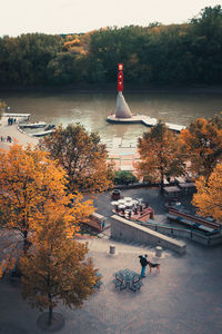 High angle view of trees by river against sky