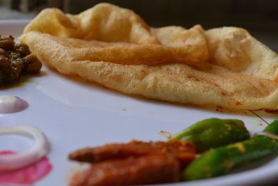 Close-up of meat with sauce in plate