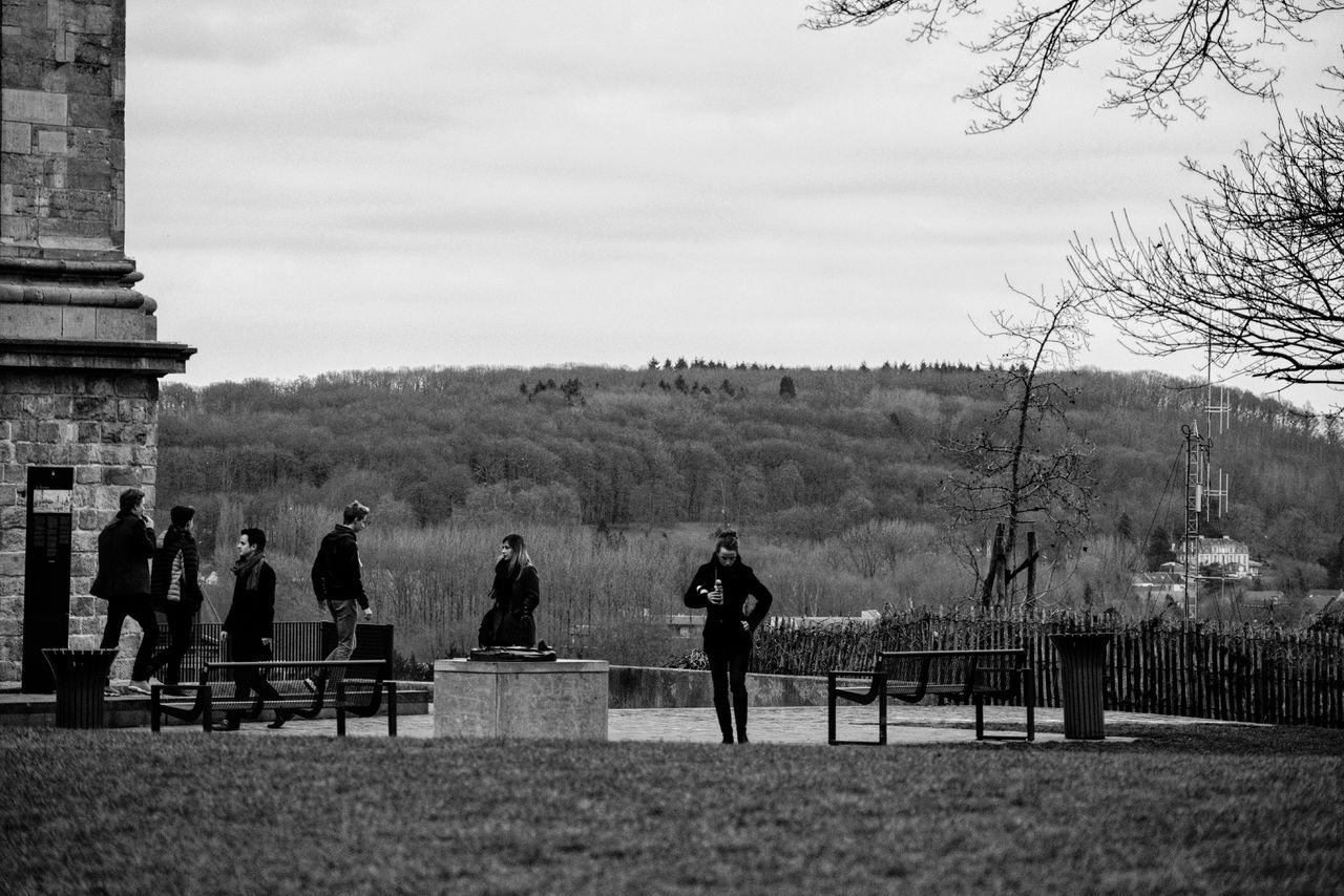 MEN STANDING ON GROUND