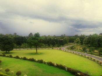 Scenic view of lake against cloudy sky