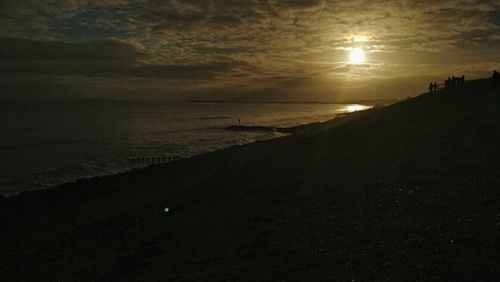 Scenic view of sea against sky at sunset