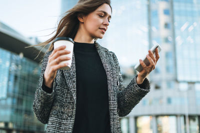 Young woman using mobile phone