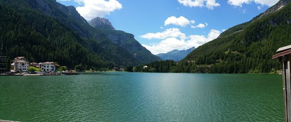 Scenic view of lake and mountains against sky