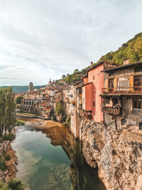 Houses on rock over river