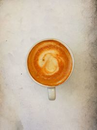 High angle view of cappuccino on table