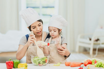 Woman having food at home