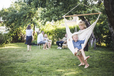 Rear view of people enjoying in park