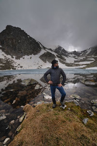 Rear view of man standing on mountain