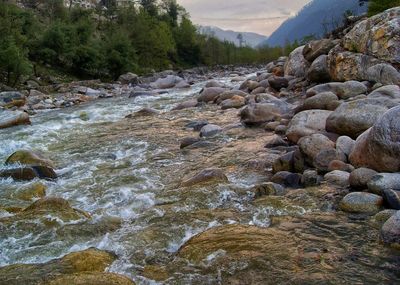 Scenic view of river flowing through rocks