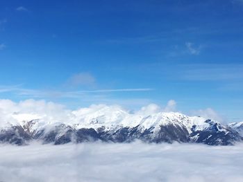 Scenic view of snowcapped mountains against sky