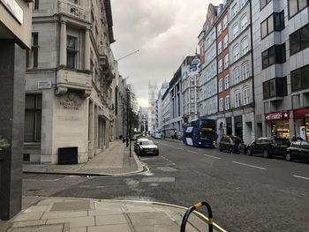 City street amidst buildings against sky