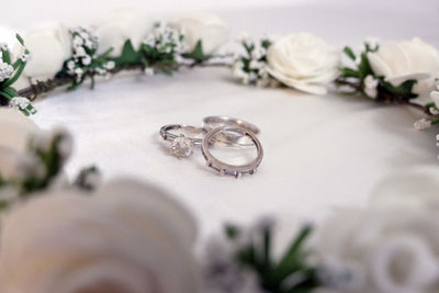 Close-up of wedding rings on table